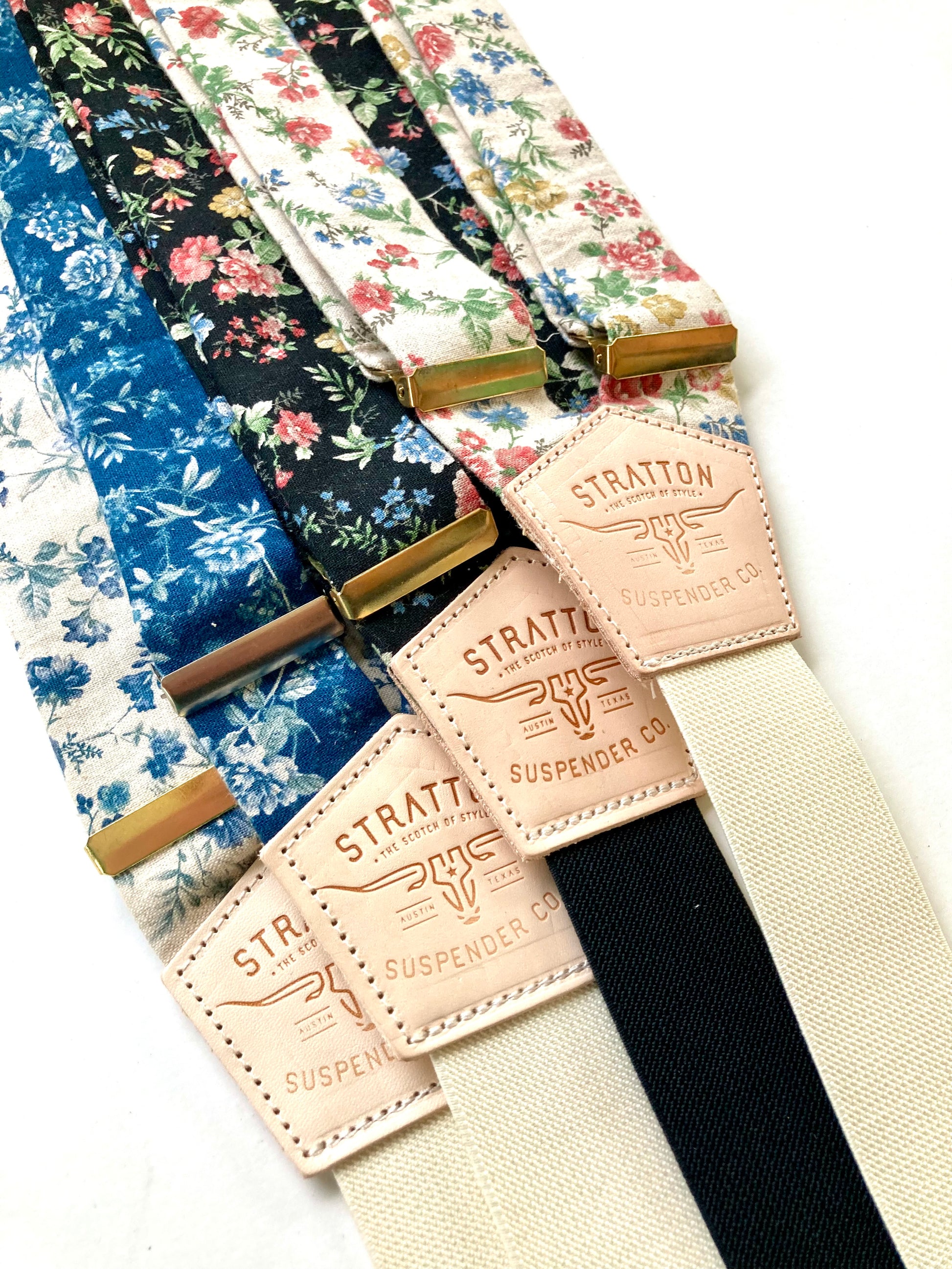 Vintage Floral Wedding Suspenders with Gold Hardware and Leather Details – Linen Button-On Braces in Blue, Black, Cream, and Ivory Floral Patterns. Perfect for Rustic, Boho, and Vintage Weddings. Handmade by Stratton Suspender Co.