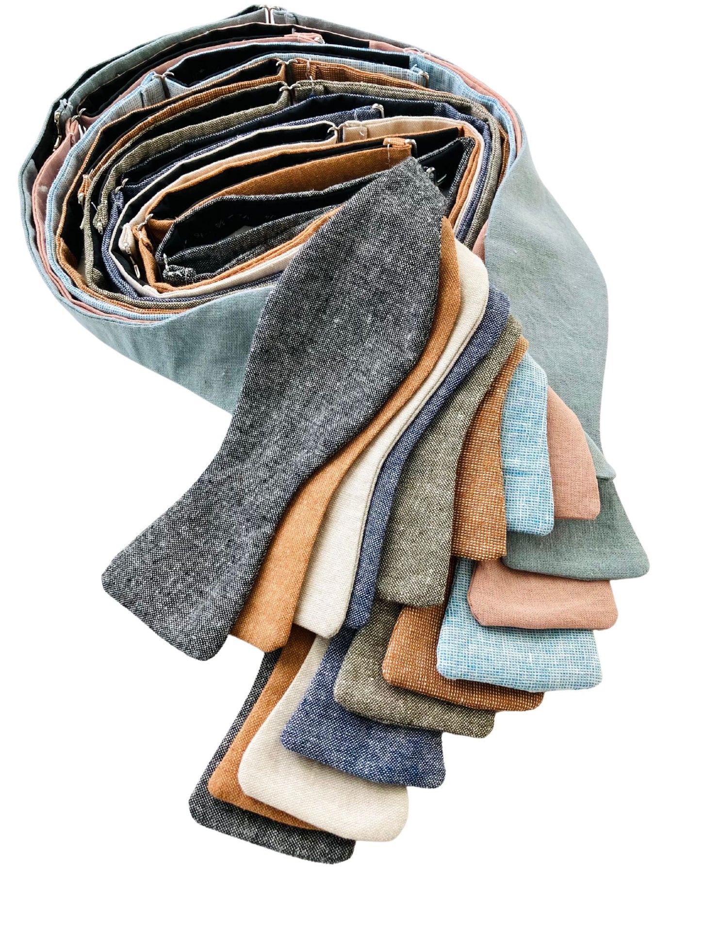 Adjustable self-tie bow ties in custom colored linen fabric, designed for weddings, groomsmen, and formalwear with polished tailoring and rustic texture.
