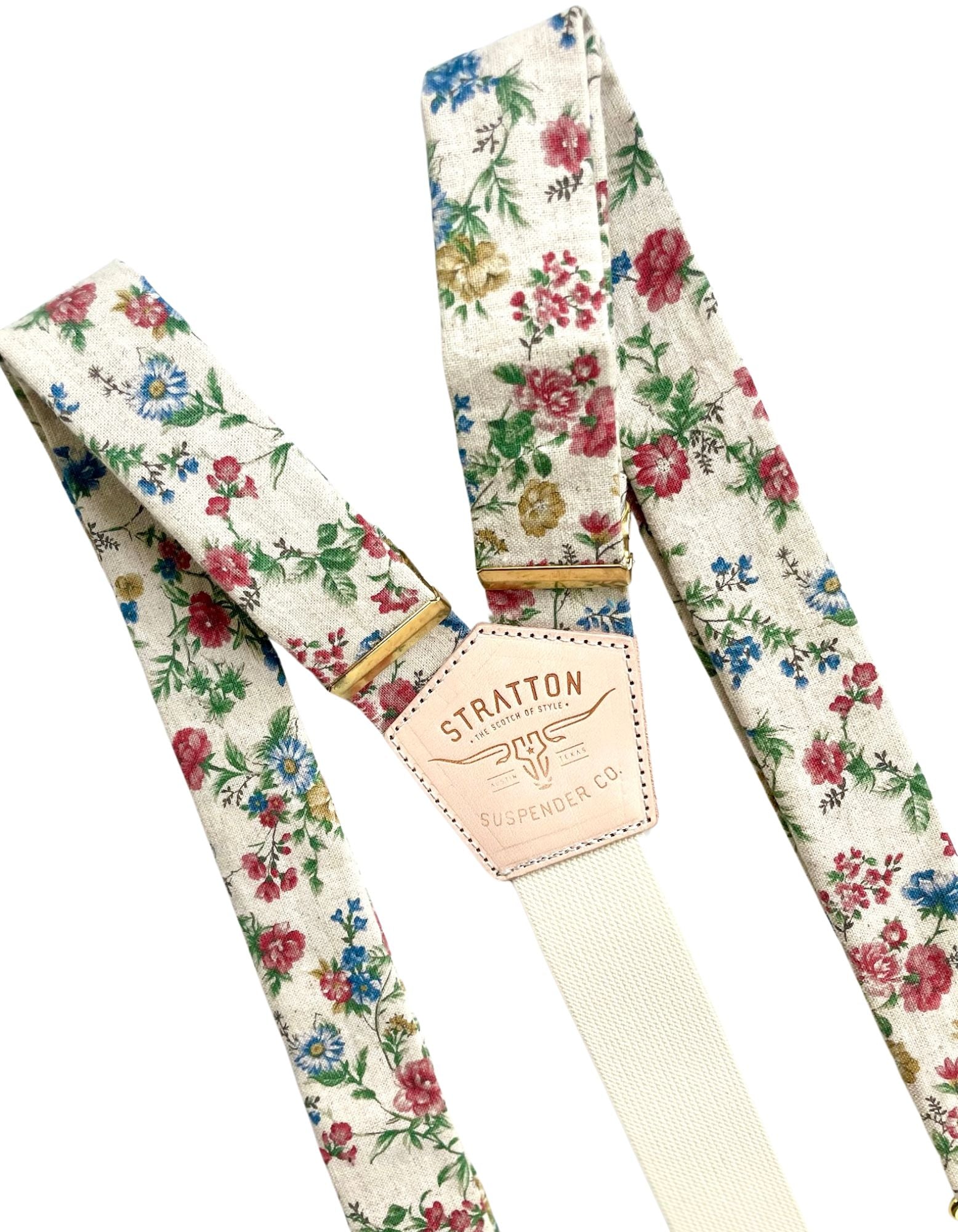 Full view of beige floral linen wedding suspenders featuring vintage floral fabric, heavyweight linen straps, and polished gold hardware. Handcrafted in Texas for grooms, groomsmen, and rustic wedding attire.