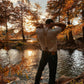 Beige linen suspenders worn with vintage Levi’s and a white tee in a fall outdoor setting—ideal for rustic weddings and groomsmen.