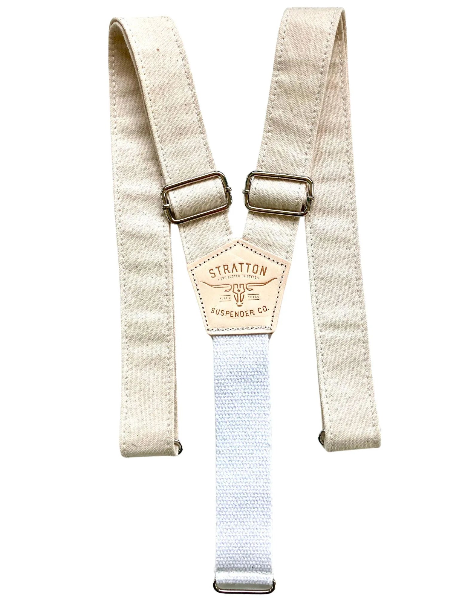Full view of rustic beige canvas suspenders with antique brass hardware, reinforced stitching, and a heavyweight white cotton webbing back strap; vintage-inspired design for heritage workwear, rugged weddings, or Western-style formalwear.
