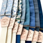 Collection of blue and floral linen wedding suspenders with ivory elastic backs, handcrafted by Stratton Suspender Co.—ideal for groomsmen, vintage menswear, and modern weddings.