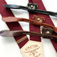 Handmade Bordeaux suspenders with black, tan, and chocolate leather button tabs and gold hardware, perfect for groomsmen outfits.