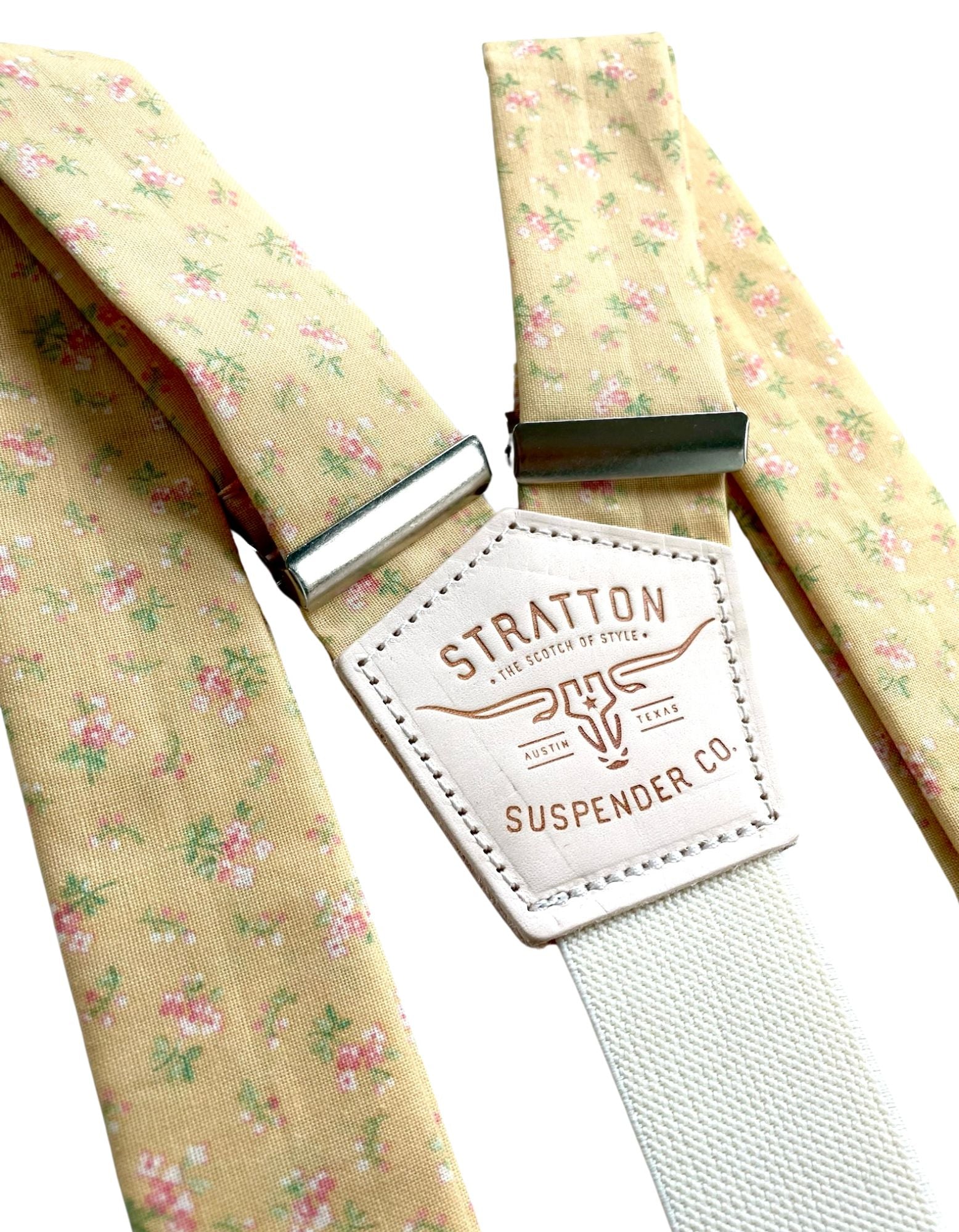 Close-up of Butter Yellow Victorian Floral Wedding Suspenders by Stratton Suspender Co., featuring delicate pink and green floral patterns with handcrafted leather detailing. Perfect for vintage-inspired weddings and garden-themed ceremonies.