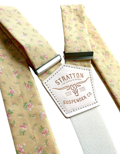Close-up of Butter Yellow Victorian Floral Wedding Suspenders by Stratton Suspender Co., featuring delicate pink and green floral patterns with handcrafted leather detailing. Perfect for vintage-inspired weddings and garden-themed ceremonies.