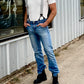 Charcoal linen button-on suspenders styled with vintage Levi’s, a Stratton Suspender Co. fitted white t-shirt, and black Dr. Martens boots. Handmade in Texas, these suspenders add a classic touch to wedding groomsmen outfits and heritage menswear.
