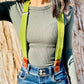 Chartreuse green linen suspenders with leather magnetic clasps styled for women’s fall fashion and boho capsule wardrobes.
