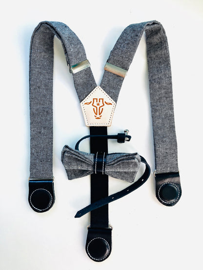 Black kids’ suspenders made of fine linen with magnetic leather clasps and a matching bow tie—ideal for formal events and ring bearer outfits.