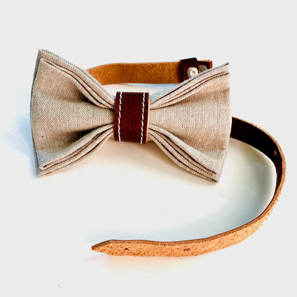 Handmade children’s bow tie featuring neutral linen and chocolate leather, pre-tied with an adjustable strap for easy wear.
