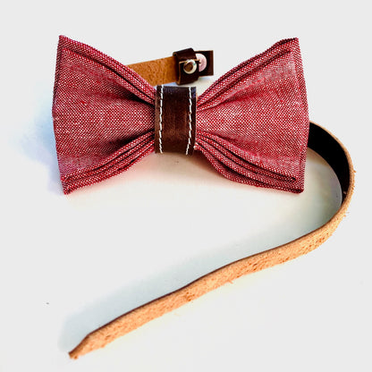 Handmade children’s red linen bow tie with rich chocolate leather accents—adjustable, pre-tied, and perfect for formal events or holidays.