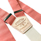 Close-up of Coral Linen suspenders with cream elastic back strap and natural leather patch by Stratton Suspender Co.
