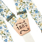 Cornflower blue and marigold floral wedding suspenders with personalized '1880' engraved leather patch, handmade by Stratton Suspender Co.