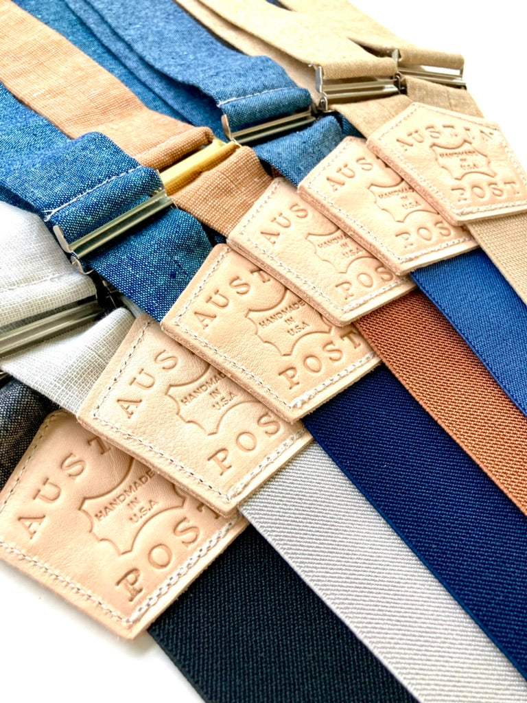 Custom leather suspenders featuring “Austin Post” branded back patches by Stratton Suspender Co. Showcasing personalized logo options for weddings, events, and branded menswear. Handmade in Texas using premium linen and leather.