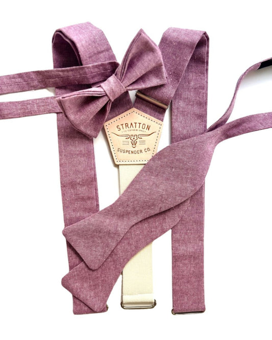 dusty mauve purple suspenders with a label on a white background