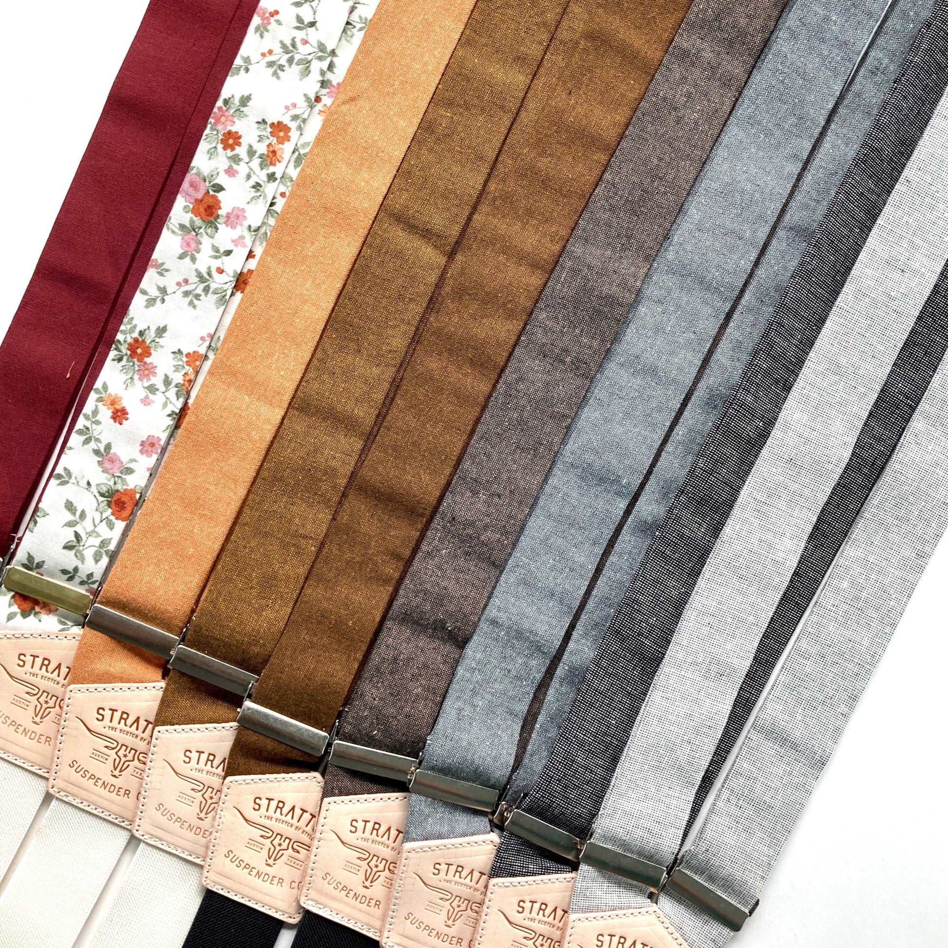 Collection of earth tone wedding suspenders in burgundy, floral, burnt orange, cinnamon, copper, espresso, shale, black formal, and charcoal formal by Stratton Suspender Co.