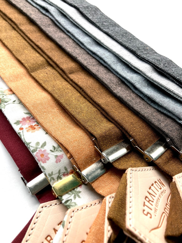 Close-Up of Fall and Winter Wedding Suspenders – Woven Linen Texture in Gray, Black, Shale, Espresso, Cinnamon, Copper, Burnt Orange, Terracotta Floral, and Burgundy – Heritage American Craftsmanship