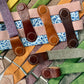 Fall women’s suspenders with brown leather magnetic clasps – blush pink, floral, olive, green, purple, and orange linen straps