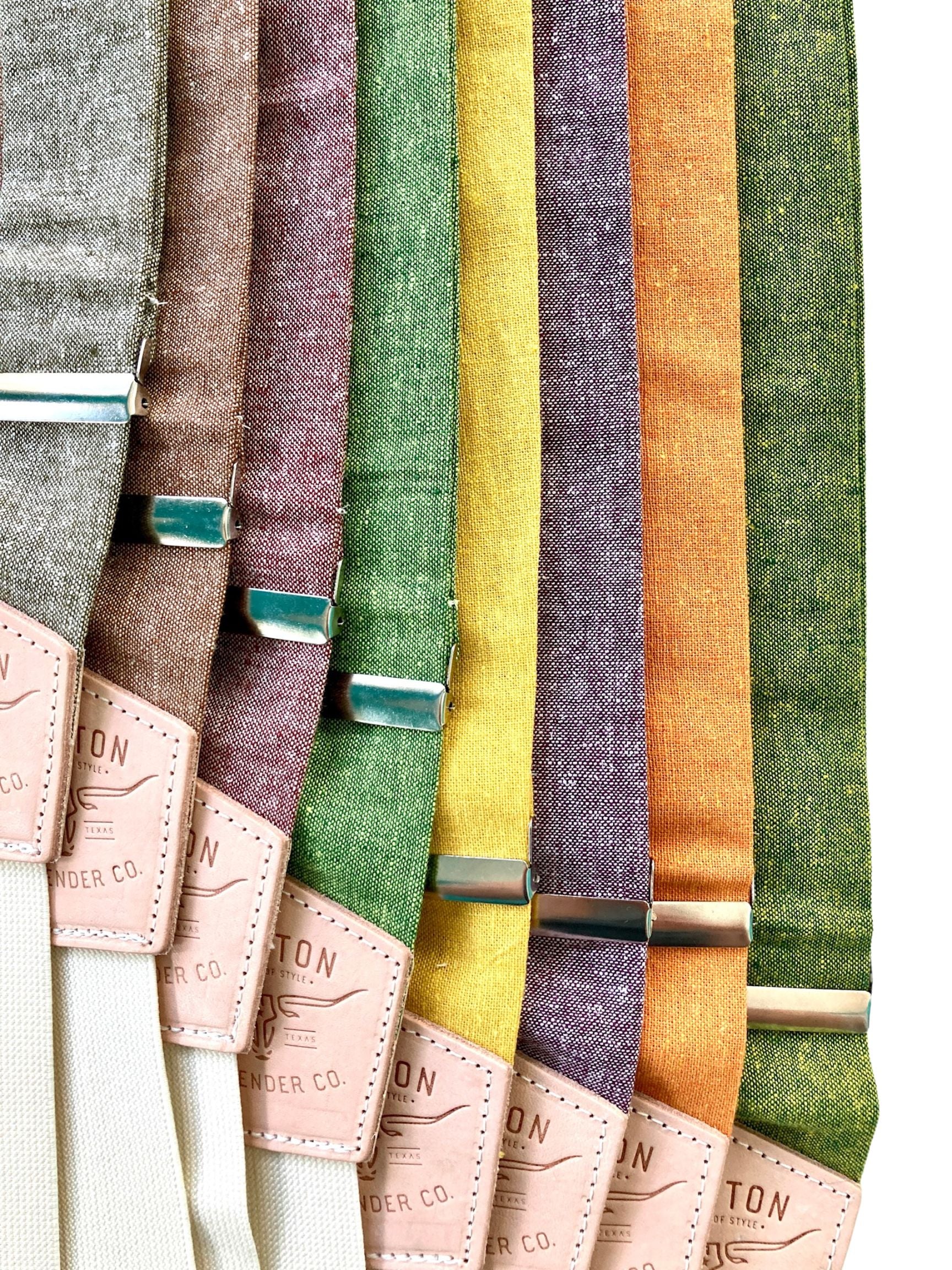 Collection of linen wedding suspenders in Forest Green, Maroon, Mustard Yellow, Burnt Orange, and Taupe by Stratton Suspender Co. Perfect for fall weddings, groomsmen attire, and vintage menswear. Handmade with premium leather detailing and adjustable straps.