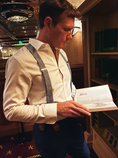Formal blue suspenders with tan magnetic clasps styled with dress shirt and slacks at the Driskill Hotel in downtown Austin.