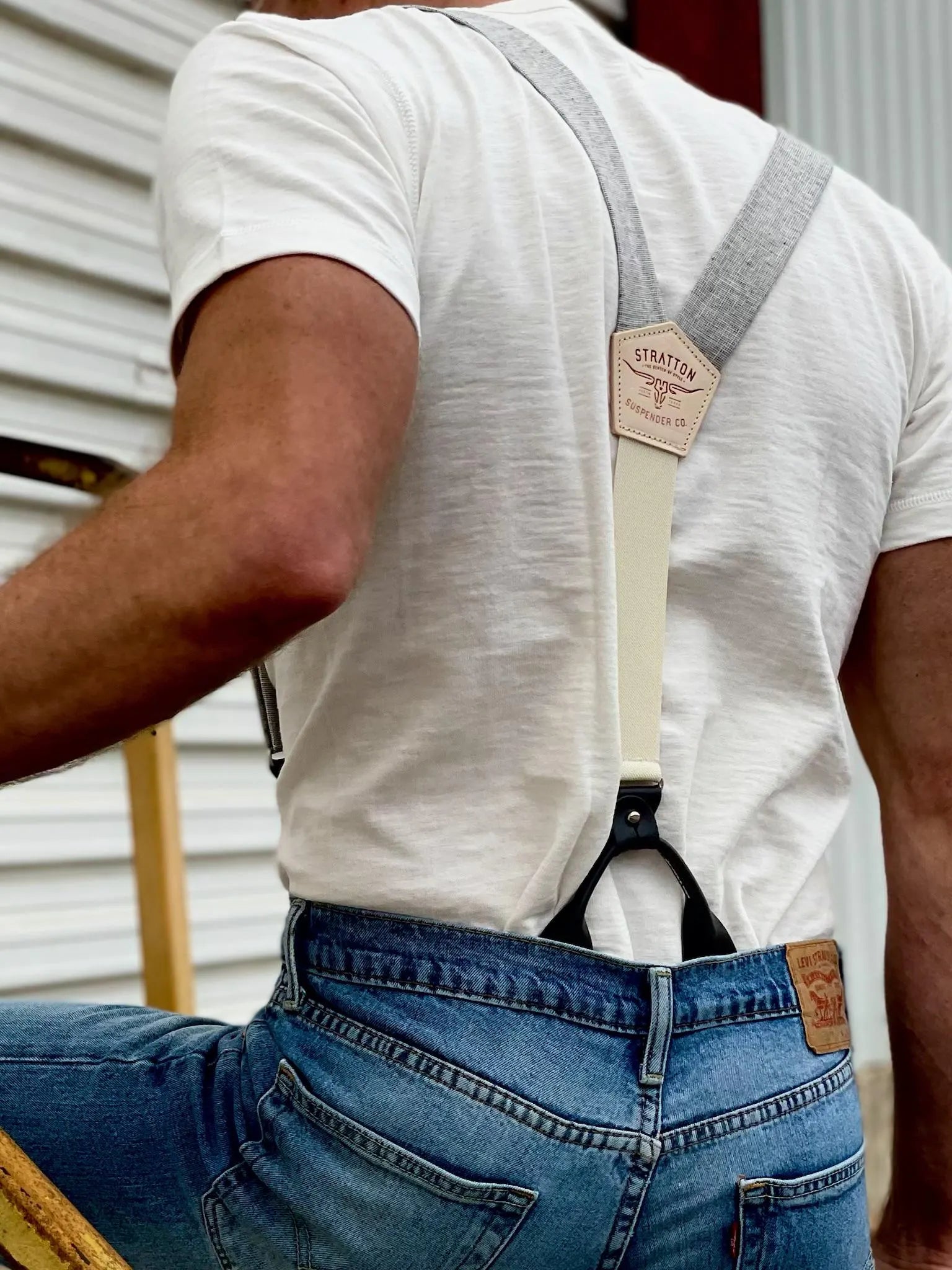 Men’s gray linen button-on suspenders with a cream back strap, black leather tabs, and a personalized back patch. Handmade in USA – perfect for rugged vintage style, weddings, and classic menswear.