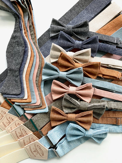 Flat lay of handmade bow ties and matching linen suspenders in neutral, earth, and pastel tones — a coordinated set for groomsmen or vintage-inspired menswear.
