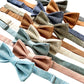 A collection of pre-tied linen bow ties with polished brass clasps in powder blue, dusty rose, dusty blue, beige, roasted pecan, olive, black, and burnt orange—perfect for groomsmen, wedding parties, formal events, and stylish workwear.