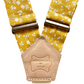 Marigold yellow floral suspender straps with leather back patch, handmade in Texas.