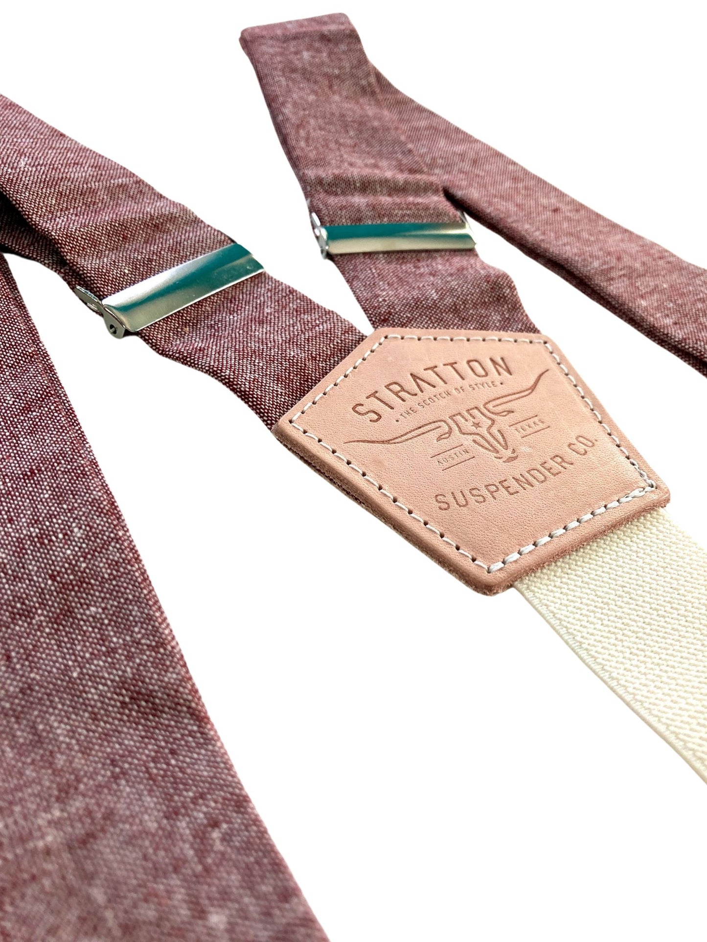 Maroon linen wedding suspenders with a vintage-inspired button-on design and handcrafted full-grain leather detailing. Features a cream elastic back strap for comfort and durability. Ideal for rustic, vintage, and formal weddings, crafted in Texas with heritage American craftsmanship.