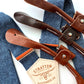 Stratton Suspender Co. nautical blue linen suspenders with tan, cognac, and chocolate full-grain leather button-on ends, ideal for groomsmen, rustic weddings, or vintage menswear.