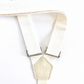 Detail of women’s white linen suspenders – handmade in Texas with premium fabric and silver adjusters