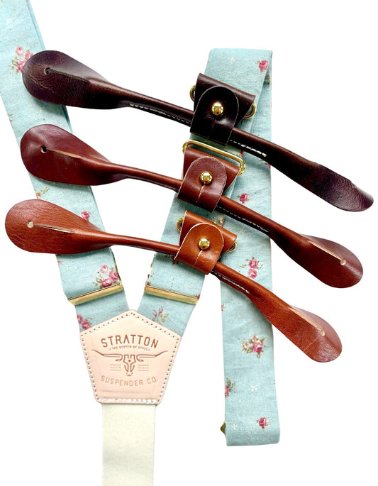 Powder blue vintage floral linen suspenders with tan, cognac, and chocolate leather button-on ends and gold hardware, handmade by Stratton Suspender Co. in Texas for groom and groomsmen wedding attire.
