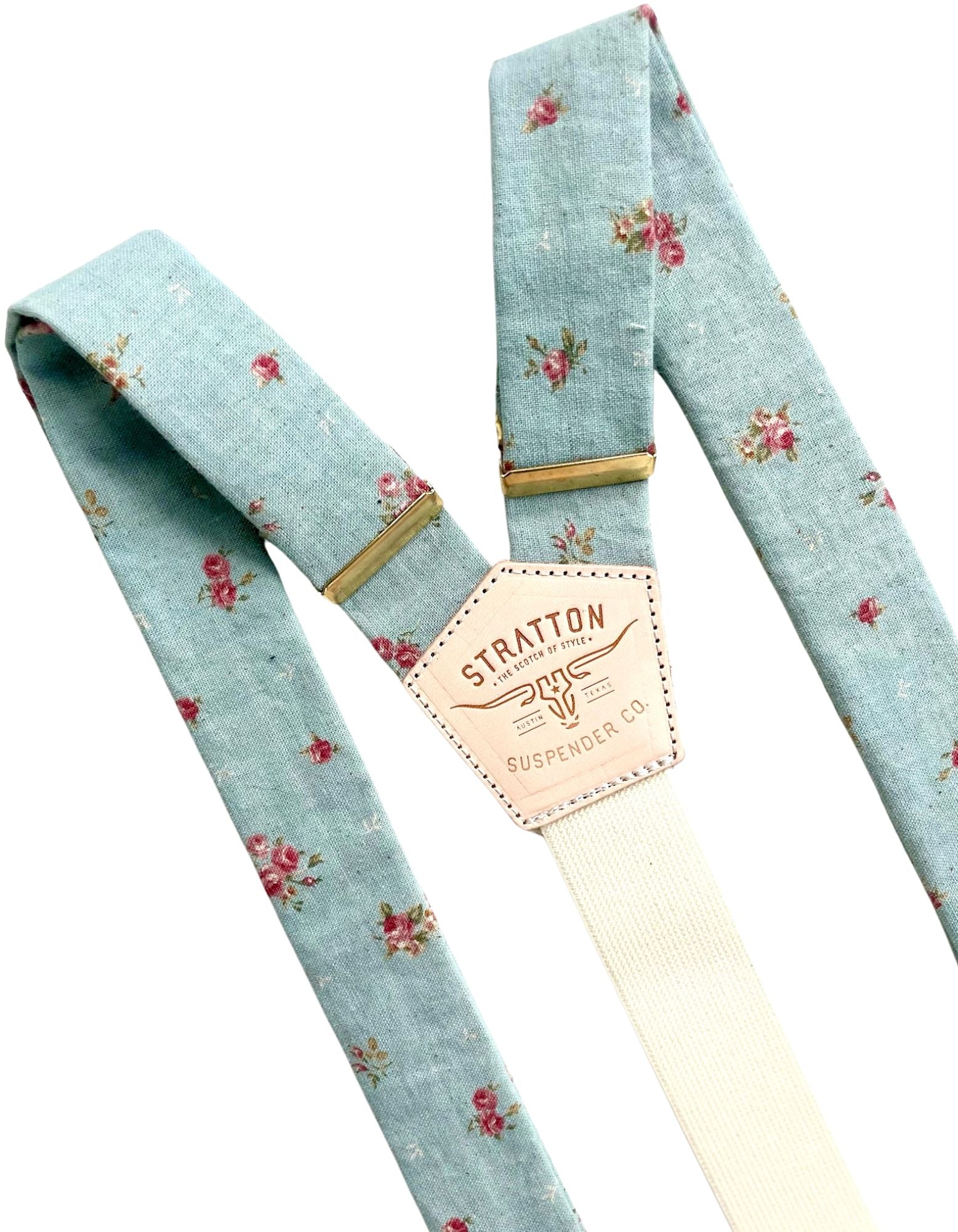 Full view of powder blue vintage floral linen suspenders with gold hardware and Stratton Suspender Co. leather patch, handmade in Texas for weddings and groomsmen.