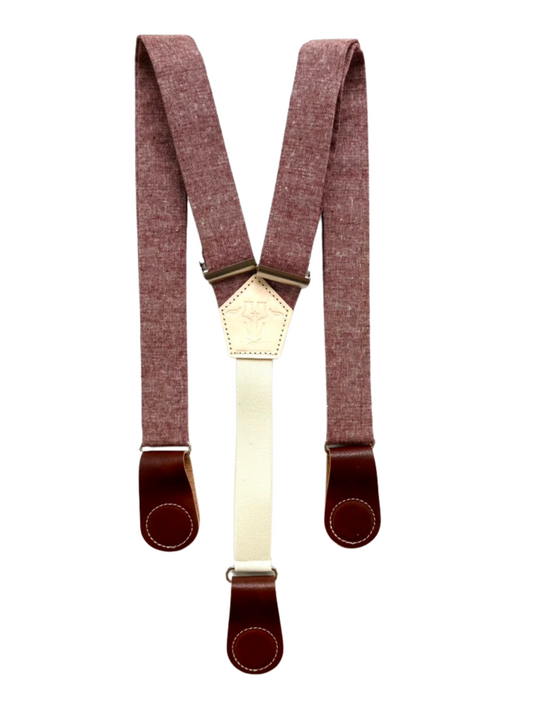 Full-view of rust maroon women’s linen suspenders with cognac leather magnetic clasps, handmade in Texas.
