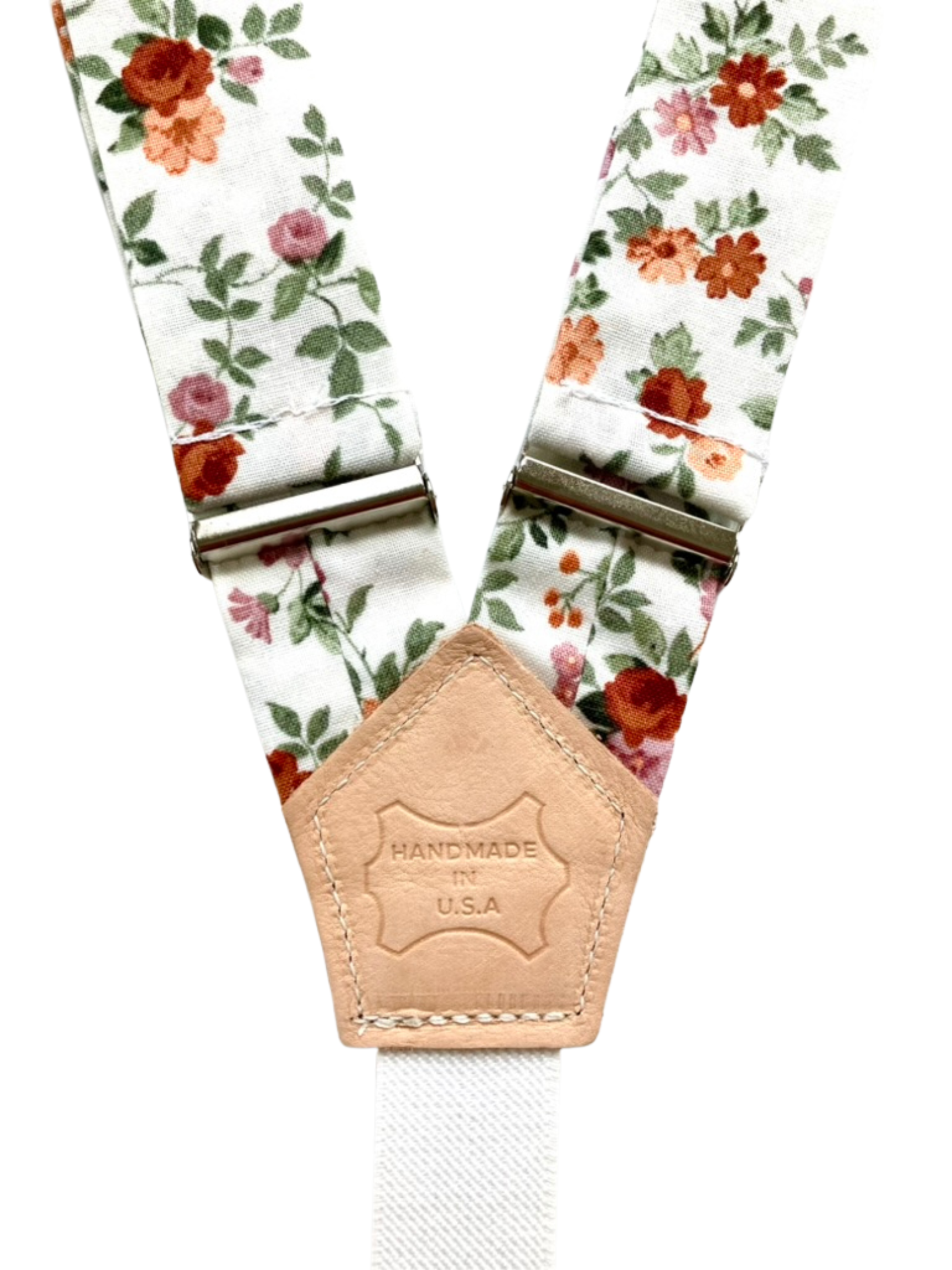 Floral linen women’s suspenders with leather patch detail, handmade in Texas by Stratton Suspender Co.