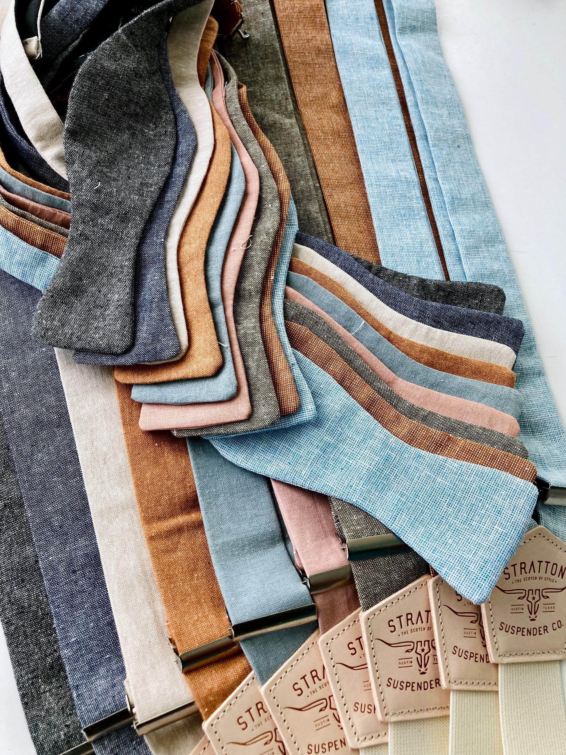Rustic linen self-tie bow ties with matching suspenders in earthy tones, perfect for groomsmen, weddings, and vintage-inspired formal menswear.