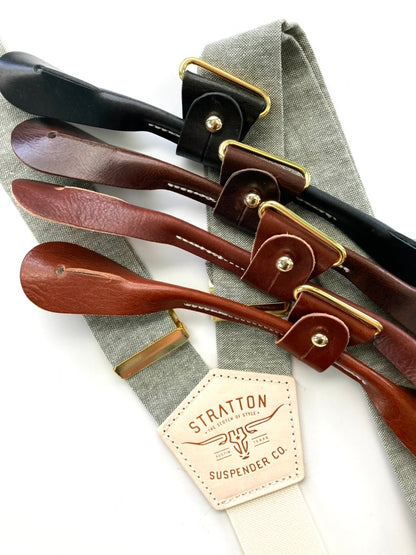 Sage green suspenders with ivory back strap and full-grain leather button-on ends in black, chocolate, cognac, and tan, handmade for groomsmen and vintage wedding style.