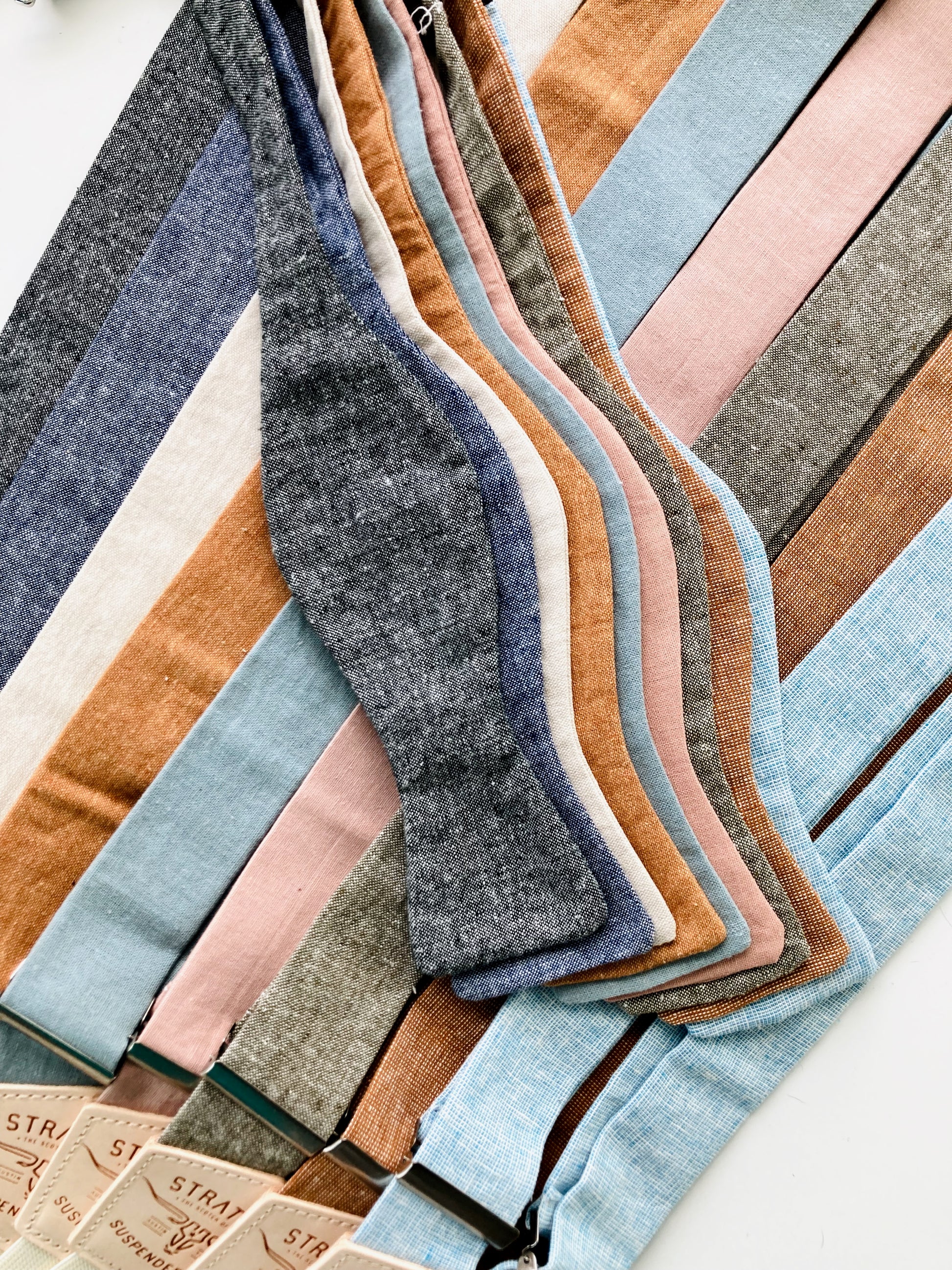 Self-tie wedding bow ties with matching suspenders for groomsmen in assorted linen colors, ideal for rustic, vintage, or formal celebrations — by Stratton Suspender Co.