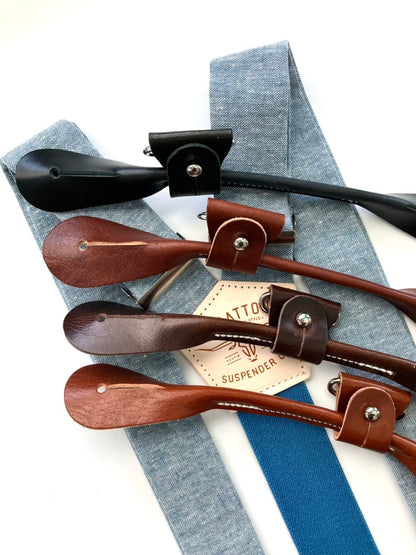Sky blue linen suspenders with deep blue elastic back strap shown with full-grain leather attachment options in black, chocolate, cognac, and tan—handmade for weddings, groomsmen, and vintage menswear by Stratton Suspender Co.