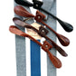 Sky blue linen suspenders with deep blue back strap and full-grain leather button-on ends in four color options — black, chocolate, cognac, and tan — handmade by Stratton Suspender Co. for groomsmen, vintage weddings, and refined menswear.