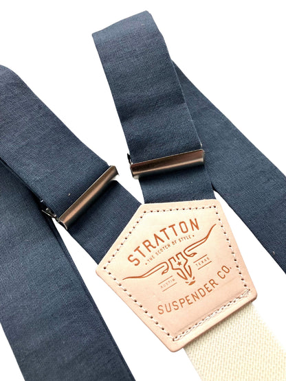 Close-up of slate blue linen button-on suspenders with vintage leather patch — handmade in USA, perfect for groomsmen or rustic weddings