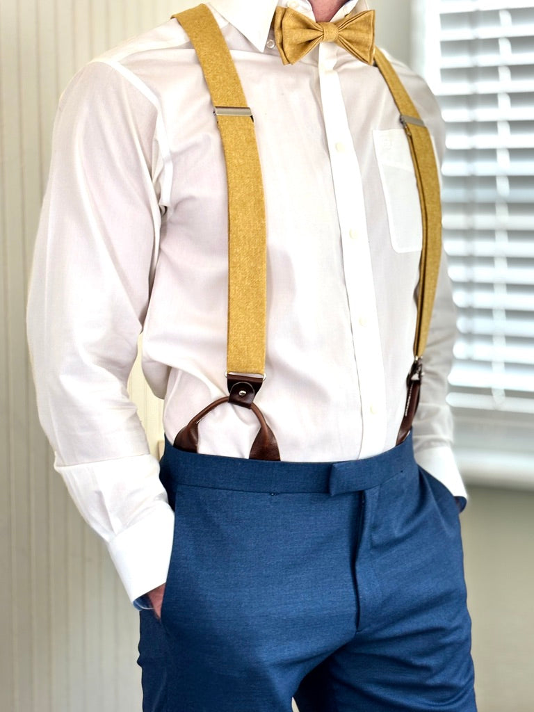 gold tie and suspenders