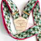 Handmade tropical palm tree suspenders with bold pink trim and Stratton Suspender Co. leather back patch, crafted in Texas—perfect for destination weddings, beach groomsmen outfits, and fun statement menswear.