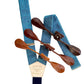 Turquoise blue Malibu linen button-on wedding suspenders with navy back strap and full-grain leather button-on attachments in chocolate, cognac, and tan. Handmade in USA – perfect for groomsmen, beach weddings, and vintage menswear.