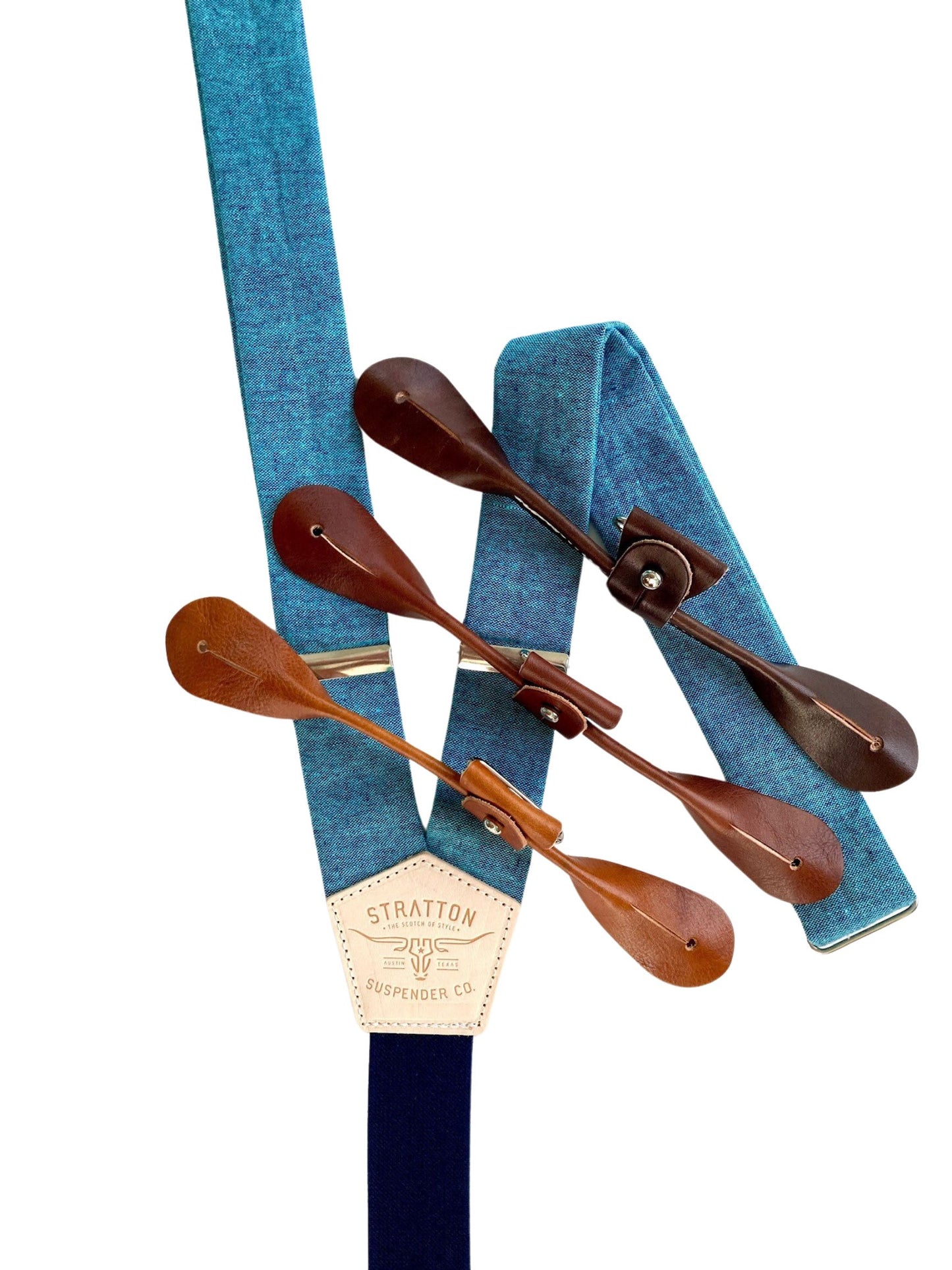 Turquoise blue Malibu linen button-on wedding suspenders with navy back strap and full-grain leather button-on attachments in chocolate, cognac, and tan. Handmade in USA – perfect for groomsmen, beach weddings, and vintage menswear.