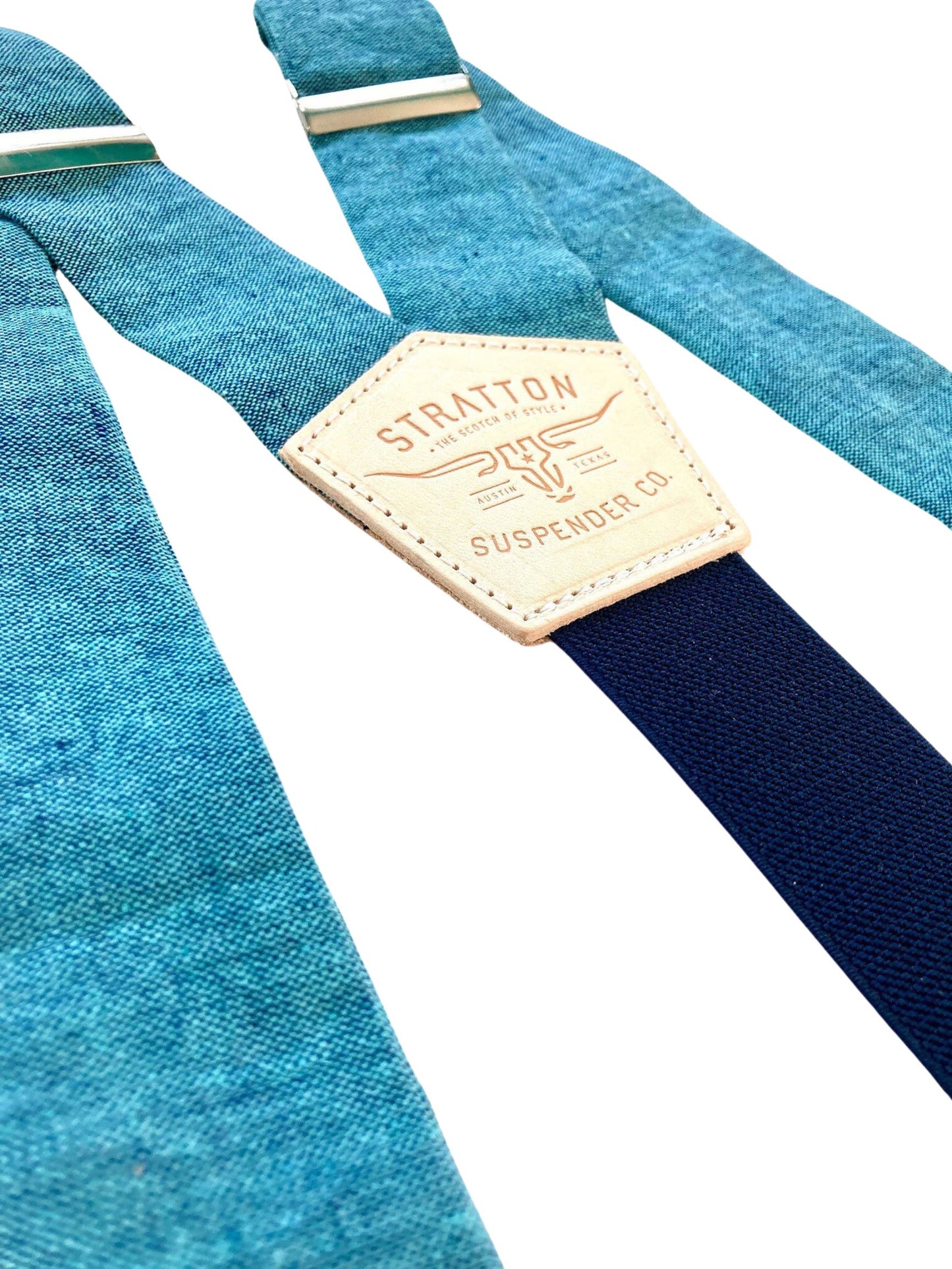 Close-up of turquoise blue Malibu linen wedding suspenders with a navy back strap and premium leather detailing. Handmade in USA – perfect for groomsmen, beach weddings, and vintage-inspired menswear.