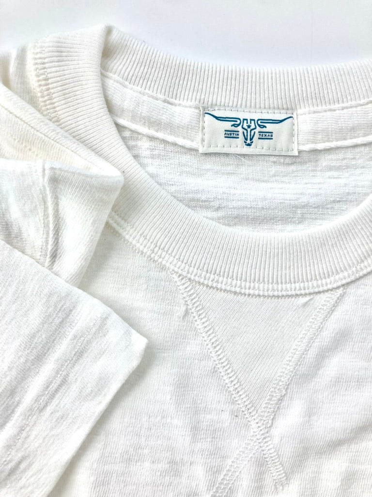 Close-up of the Vintage 1940s Heavyweight T-Shirt by Stratton Suspender Co in white, showcasing the ribbed collar, V-gusset stitching, and heritage construction. A durable, American-made classic inspired by 1940s workwear.