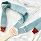 Vintage 1940s Heavyweight T-Shirt in White by Stratton Suspender Co, styled with Dusty Blue Linen Suspenders. Showcasing heritage American workwear with premium handmade suspenders featuring leather button attachments and a classic Y-back design.