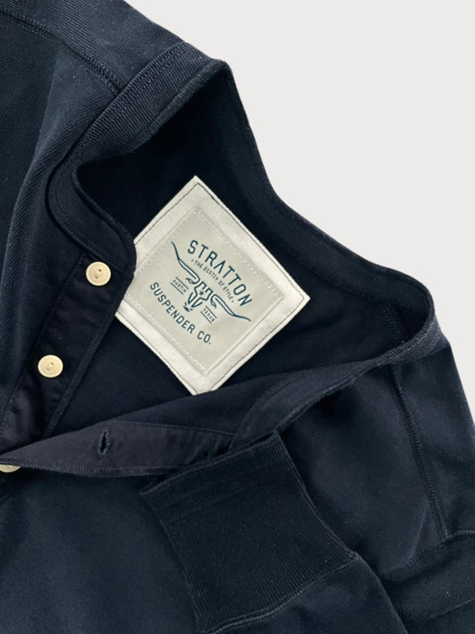 Close-up of Vintage 1940s Navy Heavyweight Henley by Stratton Suspender Co., highlighting the ribbed sleeve cuff, three-button placket, and embroidered brand label. Made in the USA from premium heavyweight cotton for durability and classic heritage workwear style.