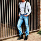 Vintage 1940s heavyweight waffle knit thermal shirt in white, styled with black suspenders, vintage Levi’s jeans, black Dr. Martens boots, and aviator sunglasses. A rugged yet refined American workwear look, embodying heritage craftsmanship and durability. Ethically made in the USA by Stratton Suspender Co.