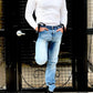 Vintage 1940s waffle knit thermal shirt in vintage white, styled with Vintage Levi’s, black suspenders, and Dr. Martens boots. This heavyweight long sleeve thermal is inspired by pre-war American workwear, offering warmth, durability, and classic style. Ethically made in the USA by Stratton Suspender Co.